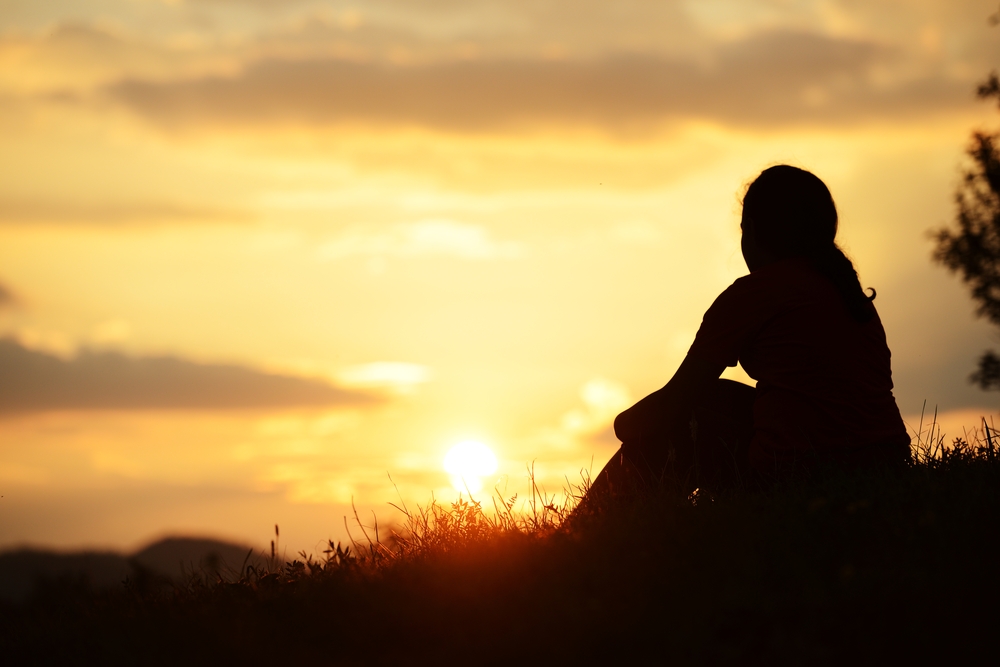 Girl spending happy time on summer nature